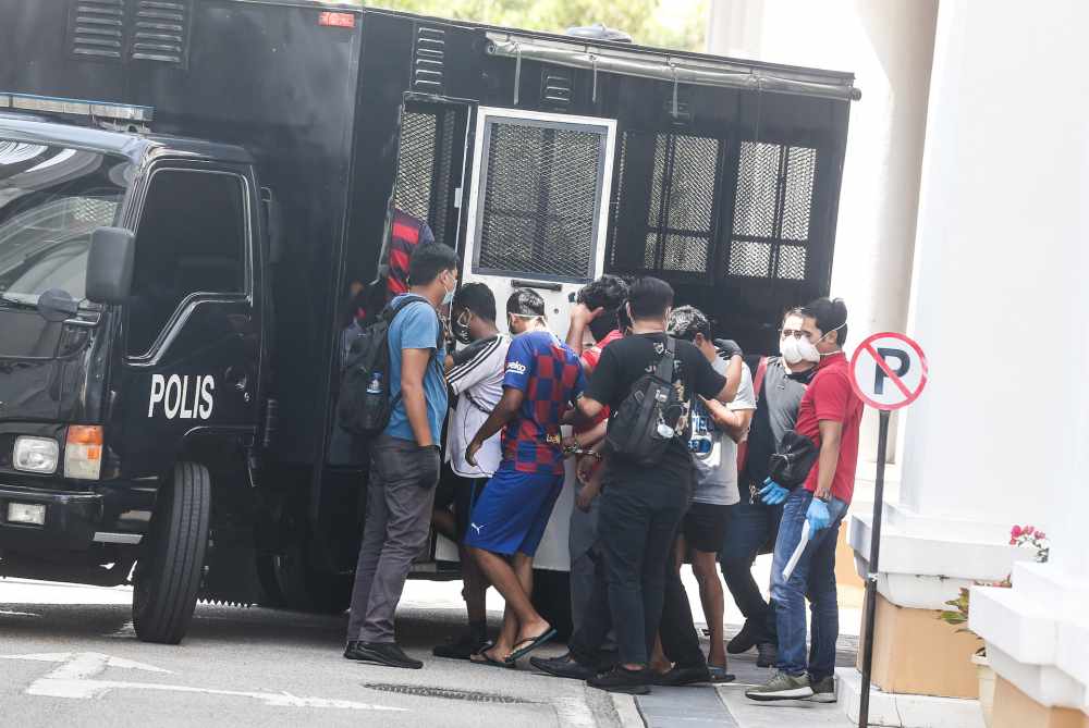 Seven men who were arrested are seen at the Magistrateu00e2u20acu2122s Court in George Town March 27, 2020. u00e2u20acu2022 Picture by Sayuti Zainudin