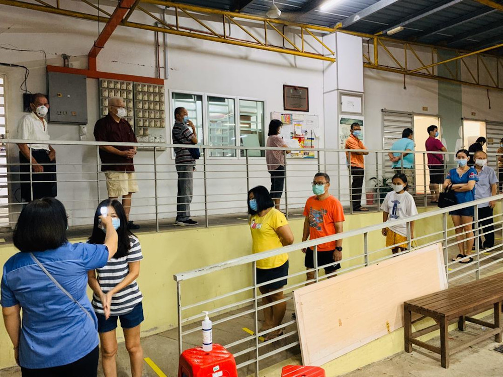 People have to queue 1 metre apart before entering Juru market in Penang March 20, 2020. u00e2u20acu201d Picture courtesy of Gooi Hsiao Leung