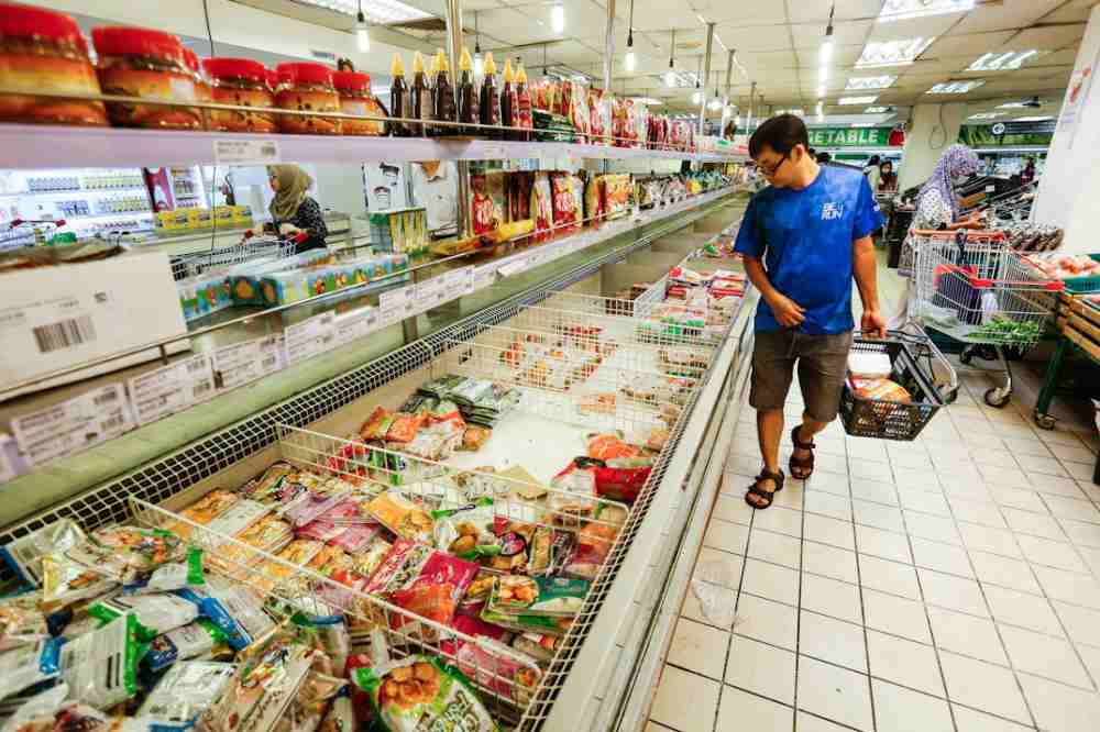 A man is seen buying frozen products section at a supermarket in George Town March 17, 2020. u00e2u20acu2022 Picture by Sayuti Zainudin