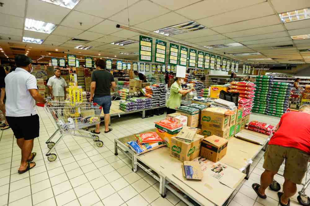 People are seen stocking up on food and other goods during the panic buying at a supermarket in George Town March 17, 2020. u00e2u20acu2022 Picture by Sayuti Zainudin