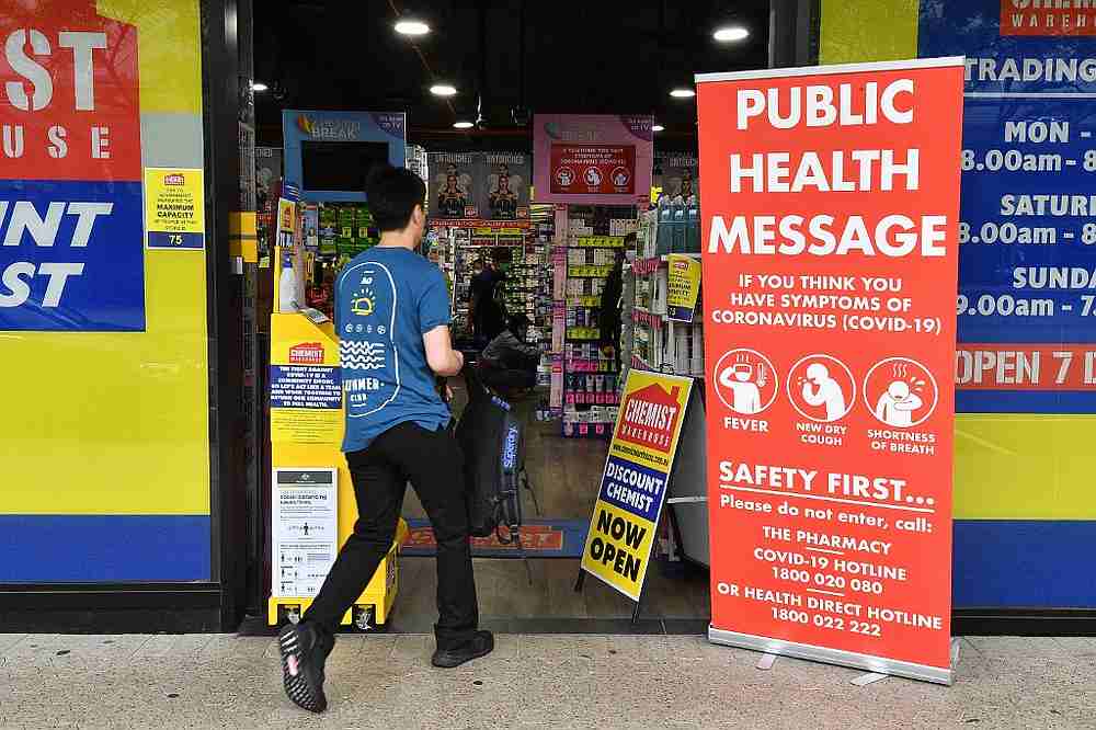 A man enters a pharmacy as people stay away due to restrictions to stop the spread of the Covid-19 outbreak in Sydney March 27, 2020. u00e2u20acu201d AFP pic