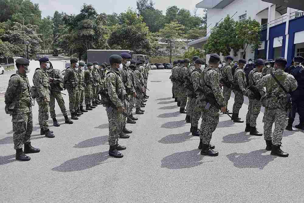 Members of Regimen 502 Askar Wataniah from Kem Sungai Buloh grouping at Shah Alam police station March 22,2020. — Picture by Miera Zulyana