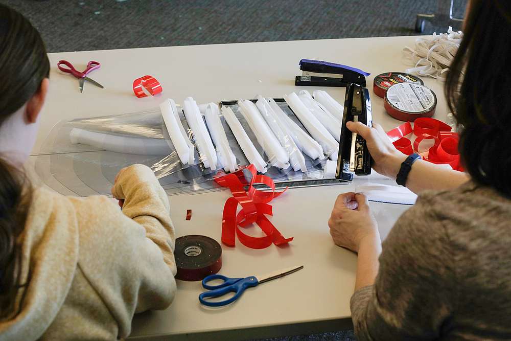 A volunteer attaches an elastic band while assembling face shields as she and other volunteers meet an urgent need of local hospitals for personal Covid-19 protective equipment in Renton, Washington March 19, 2020. u00e2u20acu201d Reuters pic