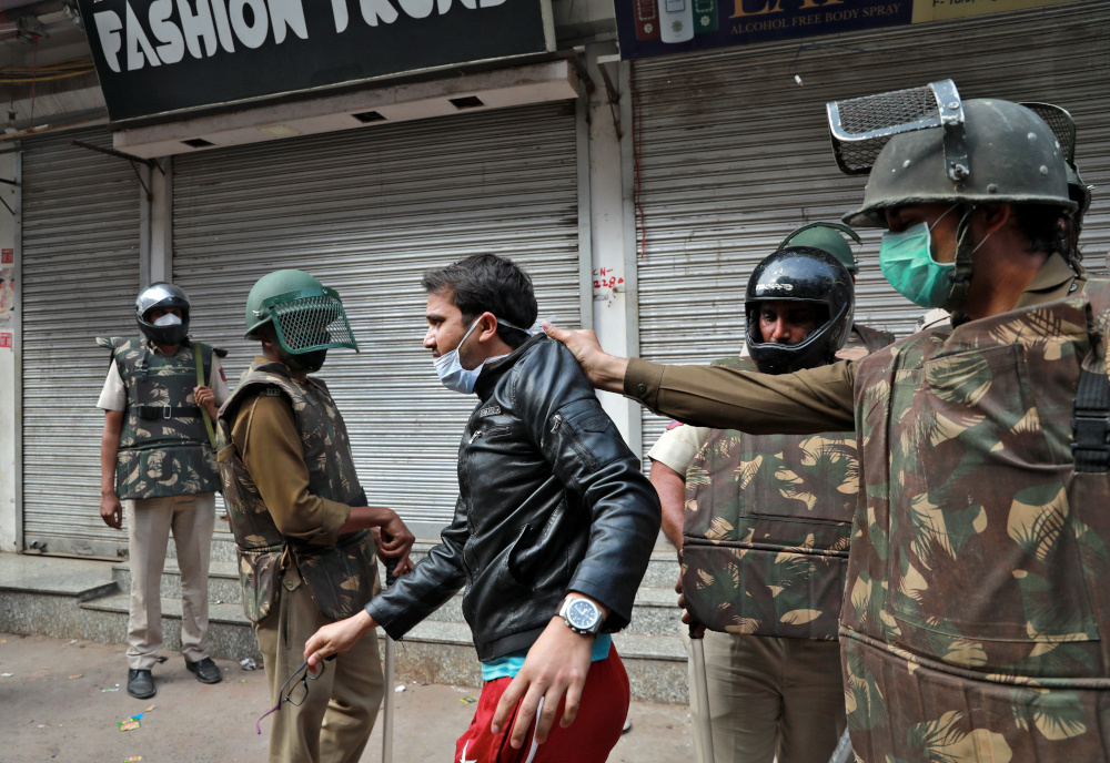 Police detain a youth as he argues with them after they cleared the site of the longest-running protest against a new citizenship law following the lockdown to limit the spreading of coronavirus disease (Covid-19), in New Delhi March 24, 2020. u00e2u20acu201d Reuters