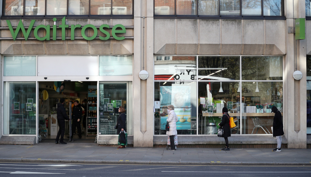 People stand apart as they follow social distancing while they queue outside a Waitrose shop in Kensington, London as the spread of the coronavirus disease (Covid-19) continues March 24, 2020. u00e2u20acu201d Reuters pic