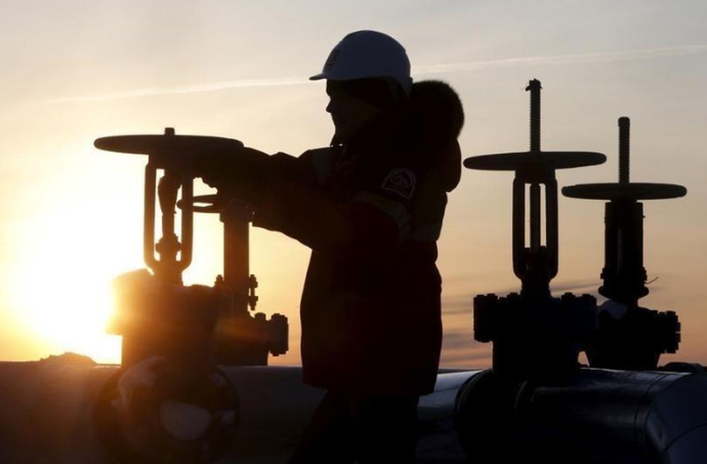 A worker checks the valve of an oil pipe at the Lukoil company owned Imilorskoye oil field outside the West Siberian city of Kogalym, Russia, January 25, 2016. u00e2u20acu201d Reuters pic