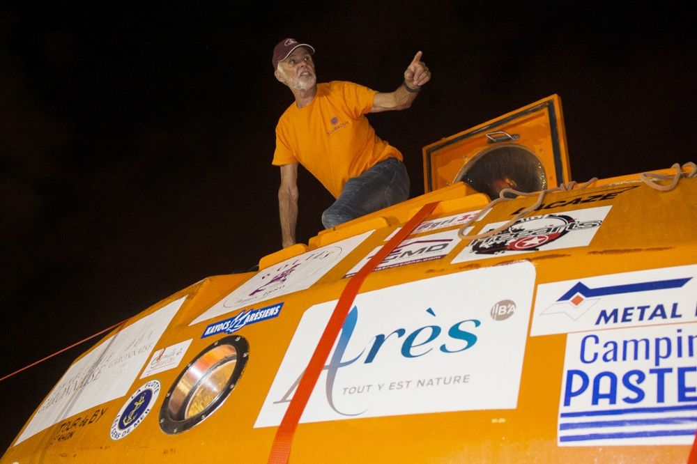 Frenchman Jean-Jacques Savin, who floated across the Atlantic in a custom-made barrel for nearly 100 days, stands on his barrel aboard the ship u00e2u20acu02dcFriendshipu00e2u20acu2122, May 9, 2019. u00e2u20acu201d AFP pic