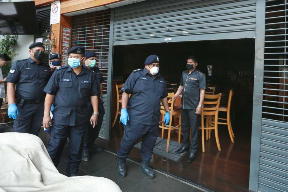 Sentul police chief Asst Comm S. Shanmugamoorthy conducts checks in the Sentul district March 19, 2020. u00e2u20acu2022 Picture by Ahmad Zamzahuri
