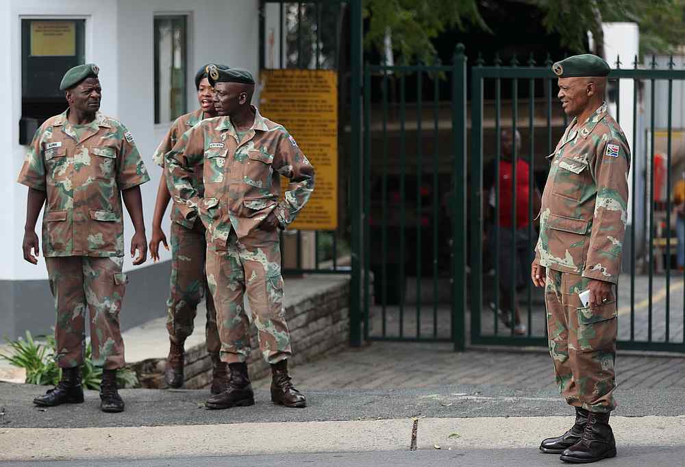 Members of the South African Army are seen outside the Rand Light Infantry Regiment Base, during the Covid-19 outbreak, in Craighall Park, South Africa March 23, 2020. u00e2u20acu201d Reuters pic