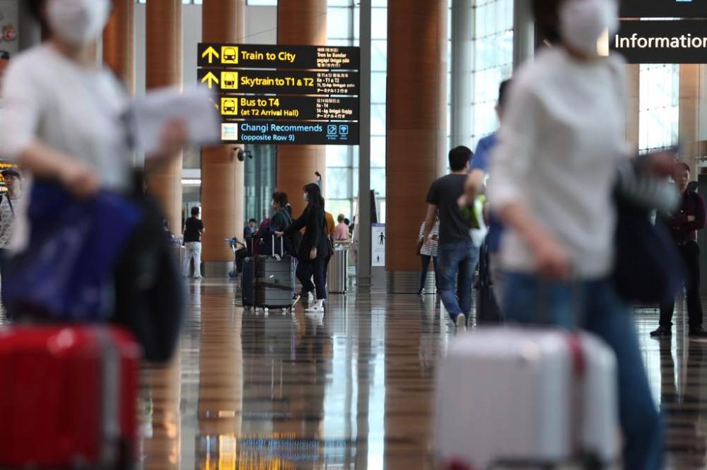 Health Minister Gan Kim Yong said on March 24, 2020 that despite the travel advisories, about 1,000 Singapore residents and long-term pass holders continue to travel abroad daily. u00e2u20acu2022 TODAY file pic
