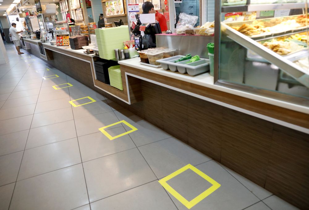 Taped-off areas for customers to distance themselves from each other are seen at a food court due to the outbreak of the coronavirus disease (COVID-19), in Singapore March 25, 2020. u00e2u20acu201d Reuters pic