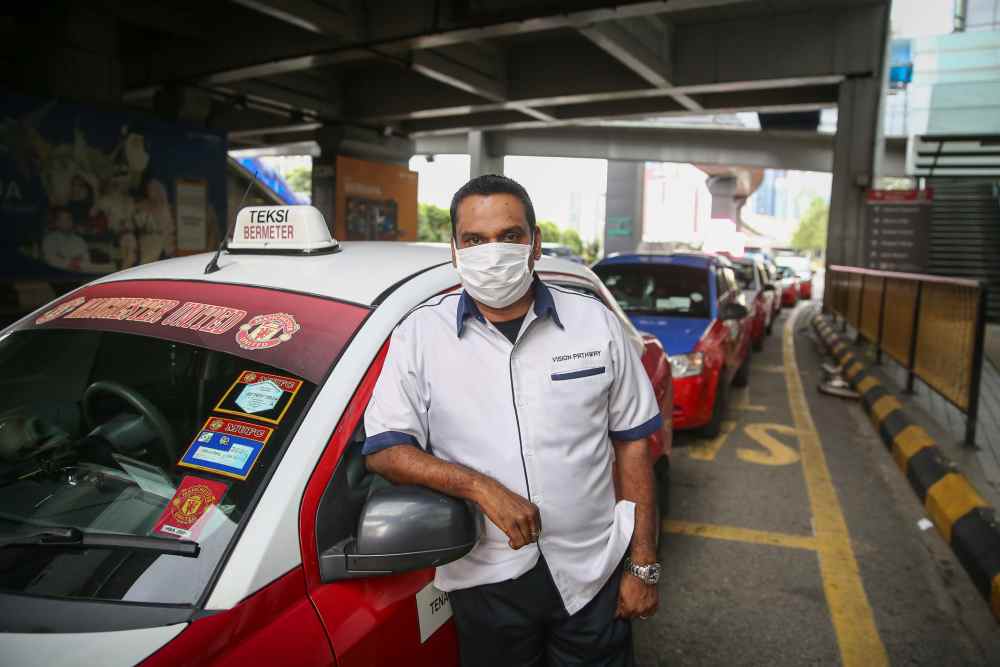 Taxi driver A. Mossess, 49, poses for a picture during an interview with Malay Mail in Kuala Lumpur March 27, 2020. 