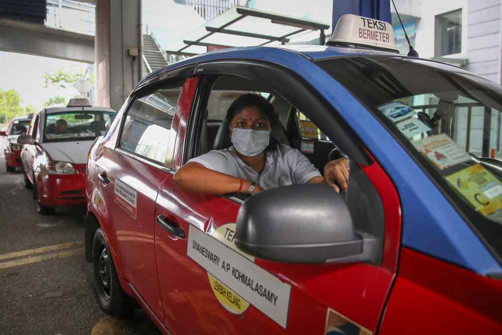 Taxi driver K. Sivaneswary, 43, poses for a picture during an interview with Malay Mail in Kuala Lumpur March 27, 2020. 