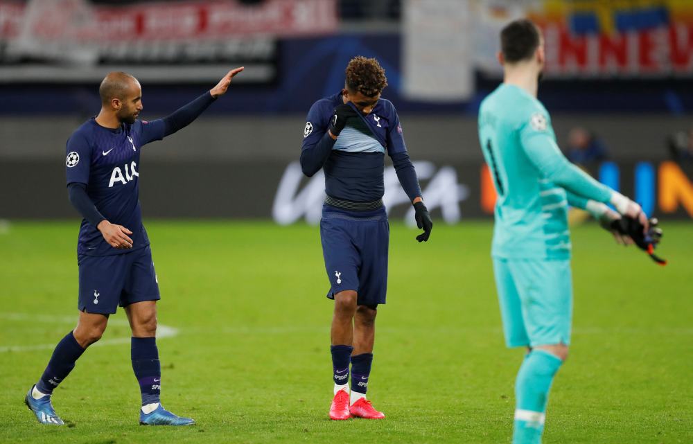 Tottenham Hotspur's Gedson Fernandes and Lucas Moura look dejected after the match against RB Leipzig March 11, 2020. u00e2u20acu2022 Reuters pic