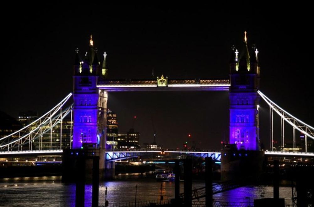 General view as Tower Bridge is lit blue in support of the NHS, as the spread of the coronavirus disease (COVID-19) continues, London, Britain, March 26, 2020. u00e2u20acu201d Reuters pic