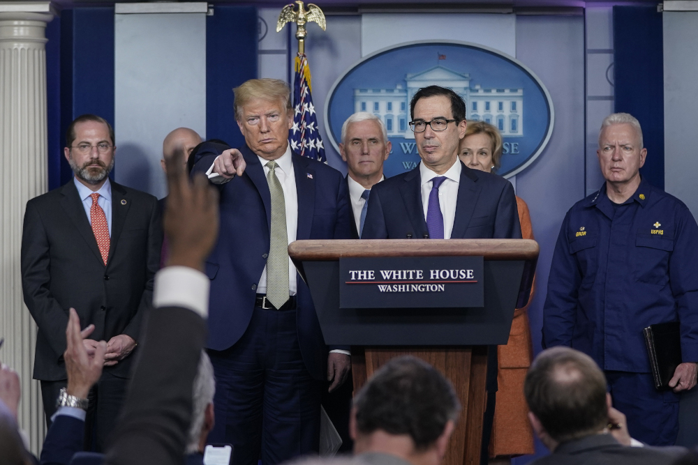 US President Donald Trump and Treasury Secretary Steven Mnuchin, joined by members of the Coronavirus Task Force at the White House March 17, 2020 in Washington, DC. u00e2u20acu201d Drew Angerer/Getty Images pic via AFP