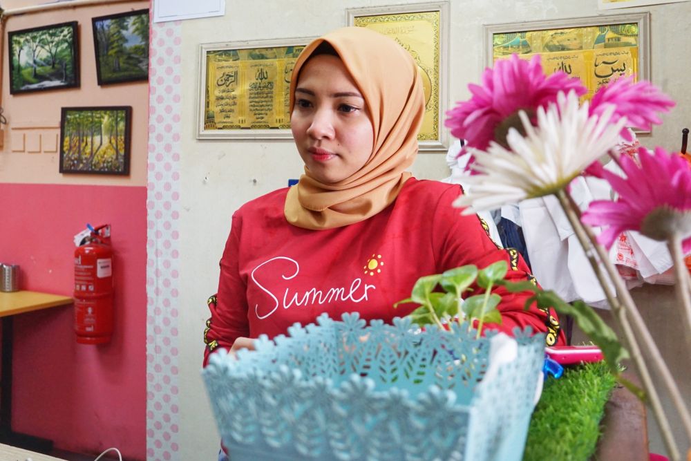 Nur Saidha Husna, who runs a family-owned mixed rice eatery in Taman Tun Dr Ismail said sales have plunged since movement control order kicked in. — Picture by Ahmad Zamzahuri