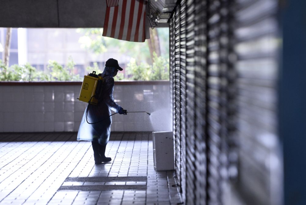 A DBKL worker sprays disinfectant at the Taman Tun Wet Market to prevent the spread of Covid-19 in Petaling Jaya March 25, 2020. u00e2u20acu201d Picture by Miera Zulyana