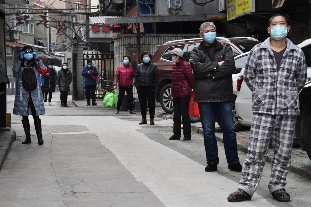 Residents line up to collect vegetables purchased through group orders at a residential area in Wuhan, the epicentre of the novel coronavirus outbreak, Hubei province, China March 5, 2020. u00e2u20acu201d Reuters pic