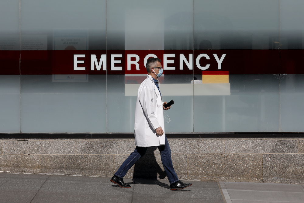 A doctor wears a protective mask as he walks outside Mount Sinai Hospital in Manhattan during the outbreak of the coronavirus disease (Covid-19) in New York City April 1, 2020. u00e2u20acu201d Reuters pic