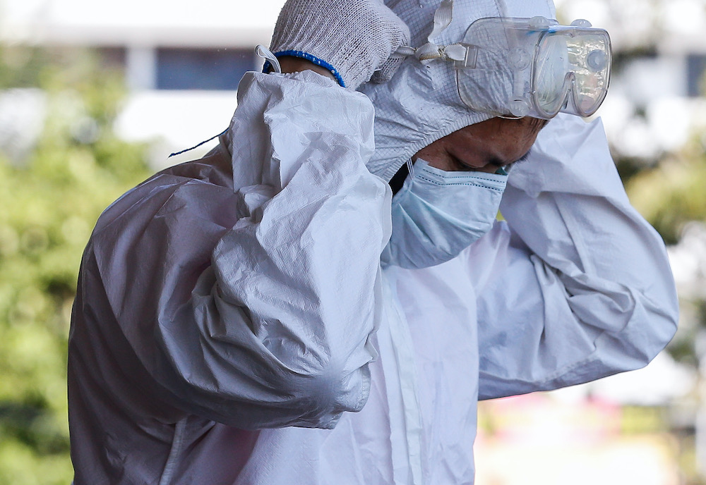 Jee Jeet Yuan, 49, preparing to carry out decontamination work at the Special Childrenu00e2u20acu2122s Centre by himself in George Town, April 4, 2020. u00e2u20acu201d Picture by Sayuti Zainudin