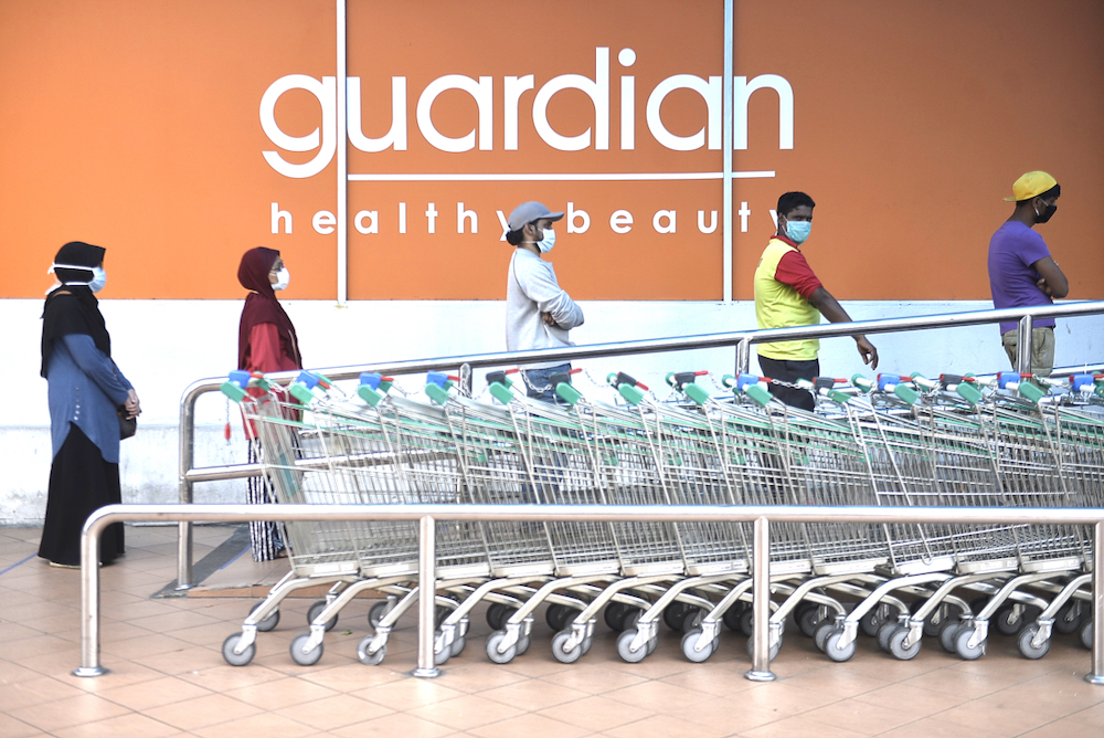People keeping their distance from each other outside Giant Hypermarket during the movement control order (MCO) in Shah Alam April 5, 2020. u00e2u20acu201d Picture by Miera Zulyana