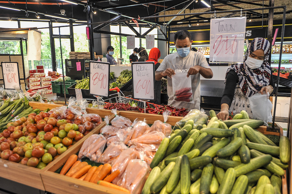 A customer buying a groceries at a supermarket in Cyberjaya April 5, 2020. u00e2u20acu201d Picture by Shafwan Zaidon