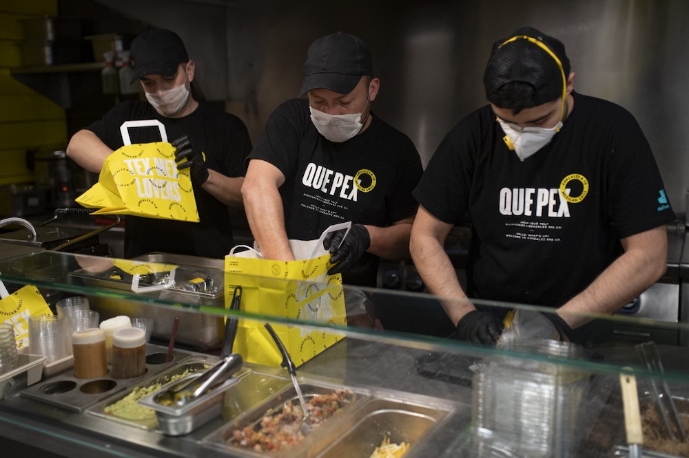 Workers of a delivery restaurant prepare meals to be delivered by Delivery4Heroes to the healthcare personnel dealing with the novel coronavirus in Barcelona April 4, 2020. u00e2u20acu201d AFP pic