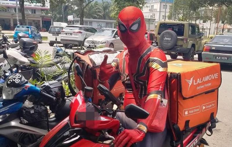 'Spiderman' was seen being questioned by the police at a roadblock last week. u00e2u20acu201d Picture courtesy of Lalamove