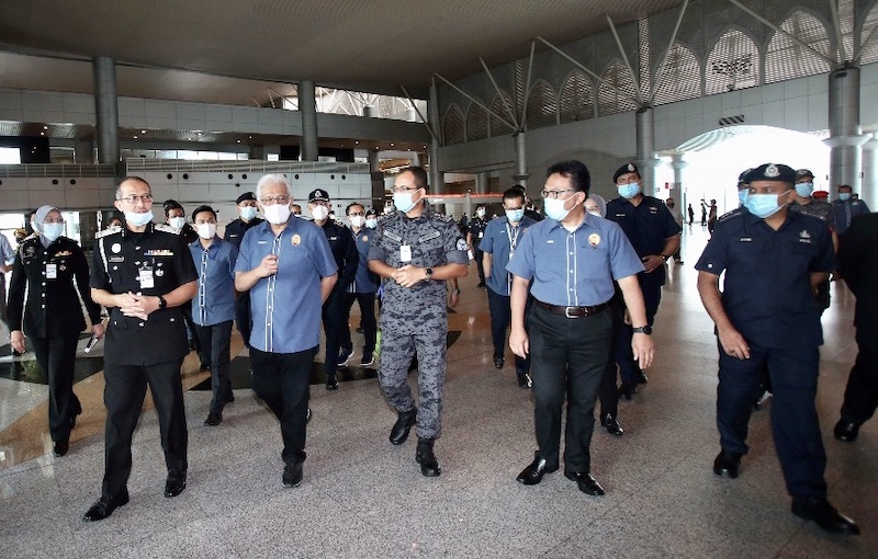 Home Minister Datuk Seri Hamzah Zainudin (3rd left) during his visit to the Bangunan Sultan Iskandar building that houses the customs, immigration and quarantine (CIQ) facility in Johor Baru April 7, 2020. u00e2u20acu201d Picture by Ben Tan