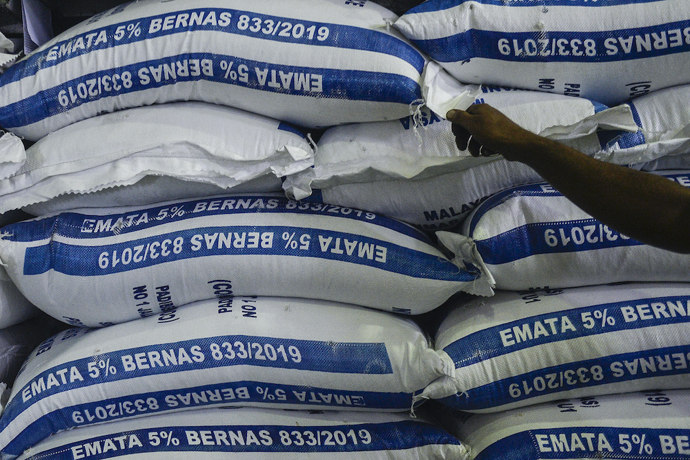 Bags of rice sit stacked in a storage room inside Syarikat Faiza Sdn Bhd in Subang Jaya April 7, 2020. u00e2u20acu201d Picture by Miera Zulyana