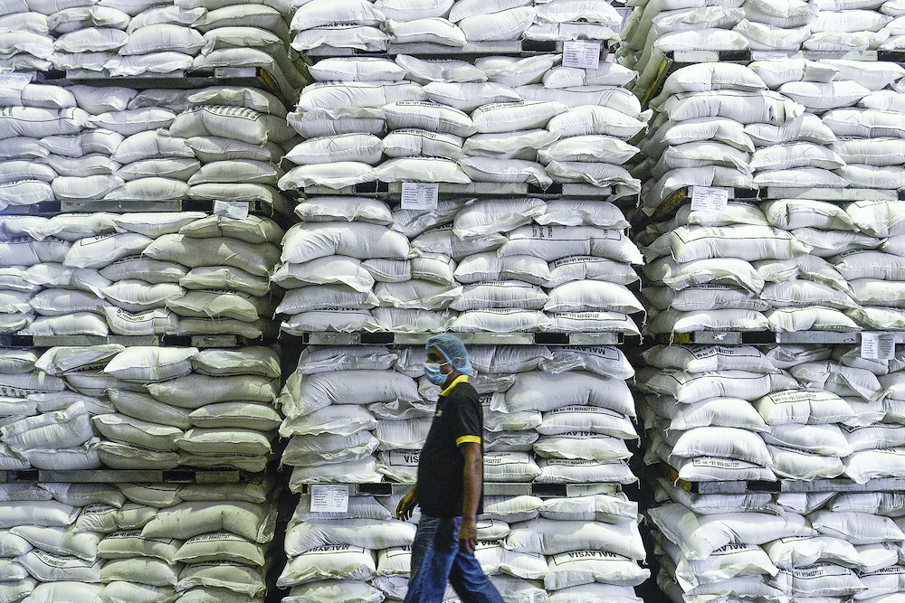 Bags of rice sit stacked in a storage room inside Syarikat Faiza Sdn Bhd in Subang Jaya April 7, 2020. u00e2u20acu201d Picture by Miera Zulyana