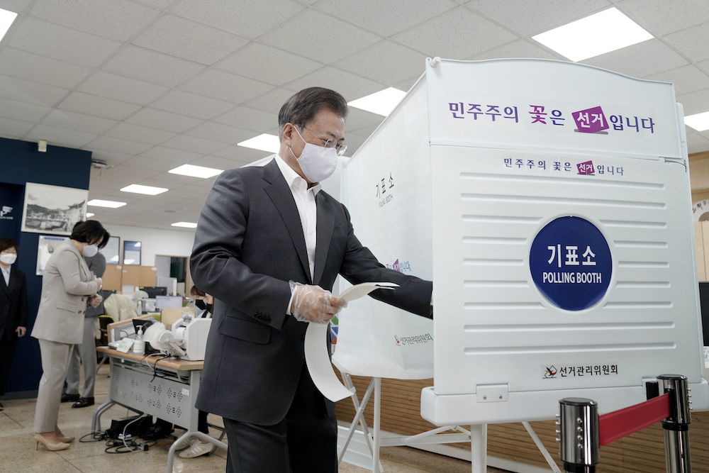 South Korean President Moon Jae-in wearing a mask and a plastic gloves arrives to cast his absentee ballot at a polling station for parliamentary election in Seoul, South Korea April 10, 2020. u00e2u20acu201d Yonhap handout via Reuters