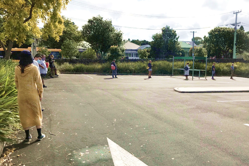 Practising social distancing when shopping for groceries.