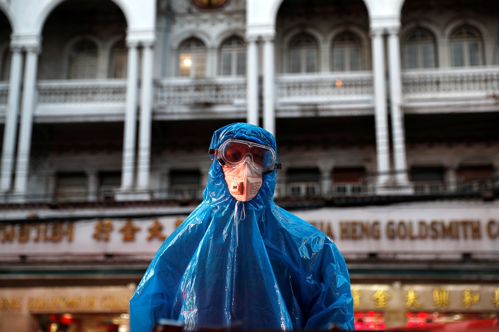 A health worker is seen on a top of a fumigation car as they spray the street to prevent the spread of the coronavirus disease in Bangkok March 30, 2020. u00e2u20acu201d Reuters pic