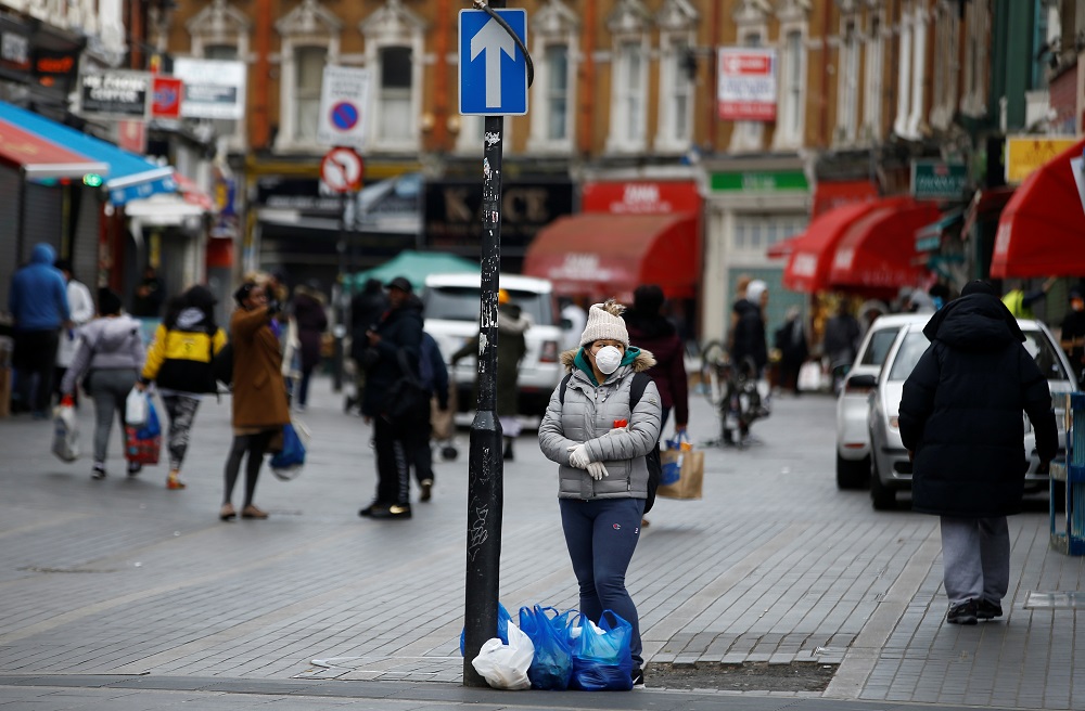 A woman wearing a mask and gloves in Brixton as the spread of the coronavirus disease continues in London March 31, 2020. u00e2u20acu201d Reuters pic