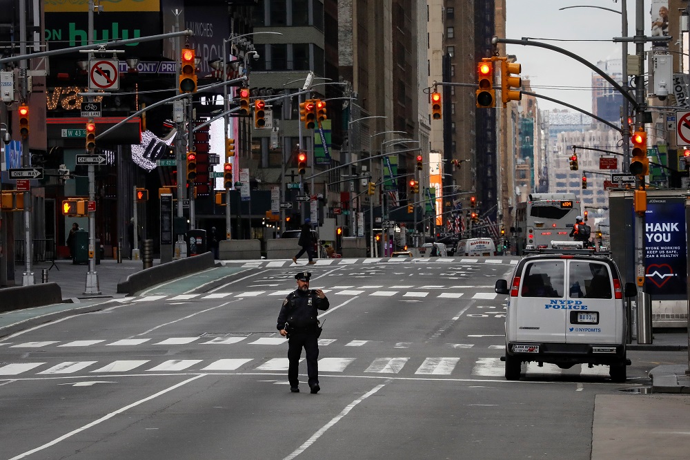 A New York City Police officer takes a selfie while in the middle of the street in an almost empty Times Square, during the coronavirus disease outbreak in New York March 31, 2020. u00e2u20acu201d Reuters pic