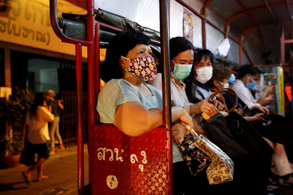 Workers wearing protective face masks ride on public transport in Bangkok during the coronavirus disease outbreak April 1, 2020. u00e2u20acu201d Reuters pic