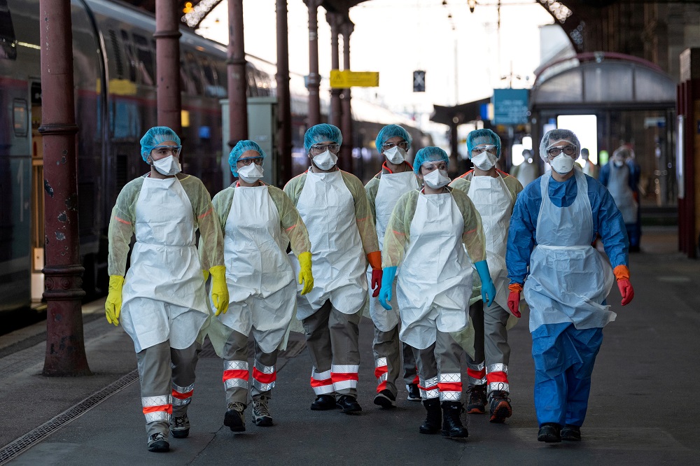 Medical staff wait for a patient, infected with coronavirus disease (Covid-19), to be embarked onboard a medicalised TGV high speed train at the station in Strasbourg, France April 3, 2020. u00e2u20acu201d Picture by Patrick Hertzog/Pool via Reuters