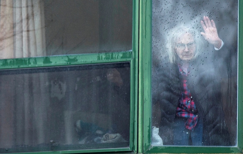 A resident waves from her window at Residence Herron, a senioru00e2u20acu2122s long-term care facility, following a number of deaths since the coronavirus disease outbreak, in the suburb of Dorval in Montreal Quebec April 13, 2020. u00e2u20acu201d Reuters pic