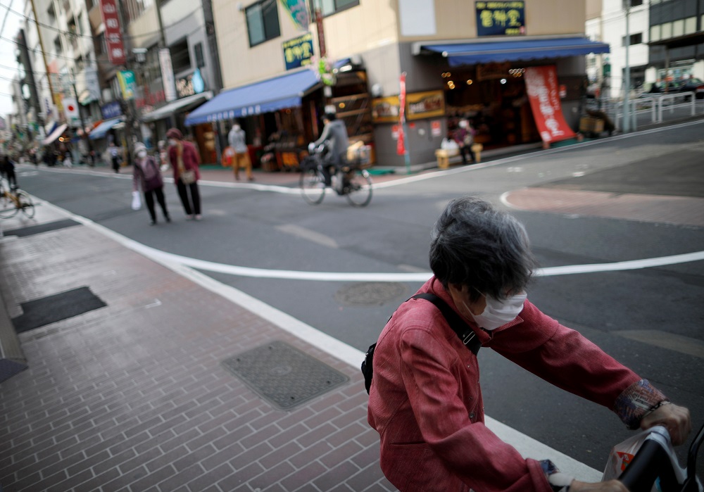 Elderly people wearing protective face masks walk on the street after the government announced state of emergency for the capital and some prefectures following the Covid-19 outbreak at Sugamo district in Tokyo April 15, 2020. u00e2u20acu201d Reuters pic