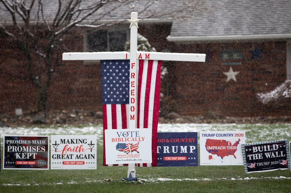 A variety of signs in support of President Donald Trump are placed across a front yard in a residential neighbourhood, amid an outbreak of coronavirus disease, in Commerce Township, Michigan April 17, 2020. u00e2u20acu201d Reuters pic