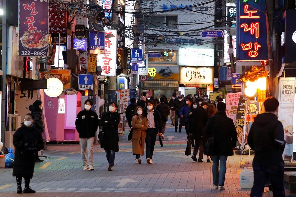 People wearing face masks to protect themselves against contracting the coronavirus disease, walk on a street in central Seoul April 22, 2020. u00e2u20acu201d Reuters pic