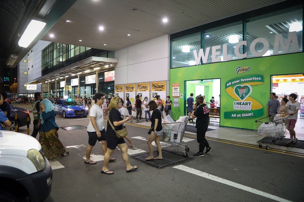Shoppers outside Giant supermarket in Tampines at around 10pm on April 3, 2020.u00e2u20acu201dTODAY pic