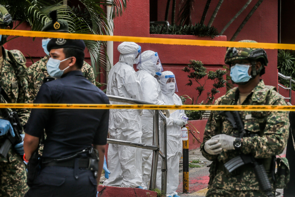 Health workers are seen at Menara City One during the enhanced movement control order (EMCO) in Kuala Lumpur April 5, 2020. u00e2u20acu201d Picture by Firdaus Latif