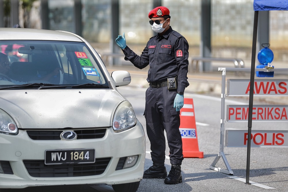 An FRU personnel mans a roadblock on Jalan PJU 7/1 in Petaling Jaya April 10,2020. u00e2u20acu201d Picture by Ahmad Zamzahuri