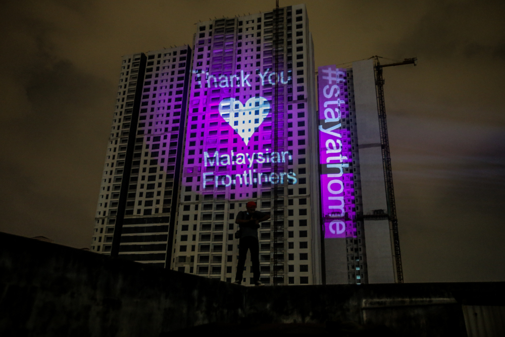 A general view showing the projection mapping on a building reading u00e2u20acu02dc#stayathomeu00e2u20acu2122 and u00e2u20acu02dcThank You Malaysian Frontlinersu00e2u20acu2122 in Kuala Lumpur April 10, 2020. u00e2u20acu201d Picture by Hari Anggara