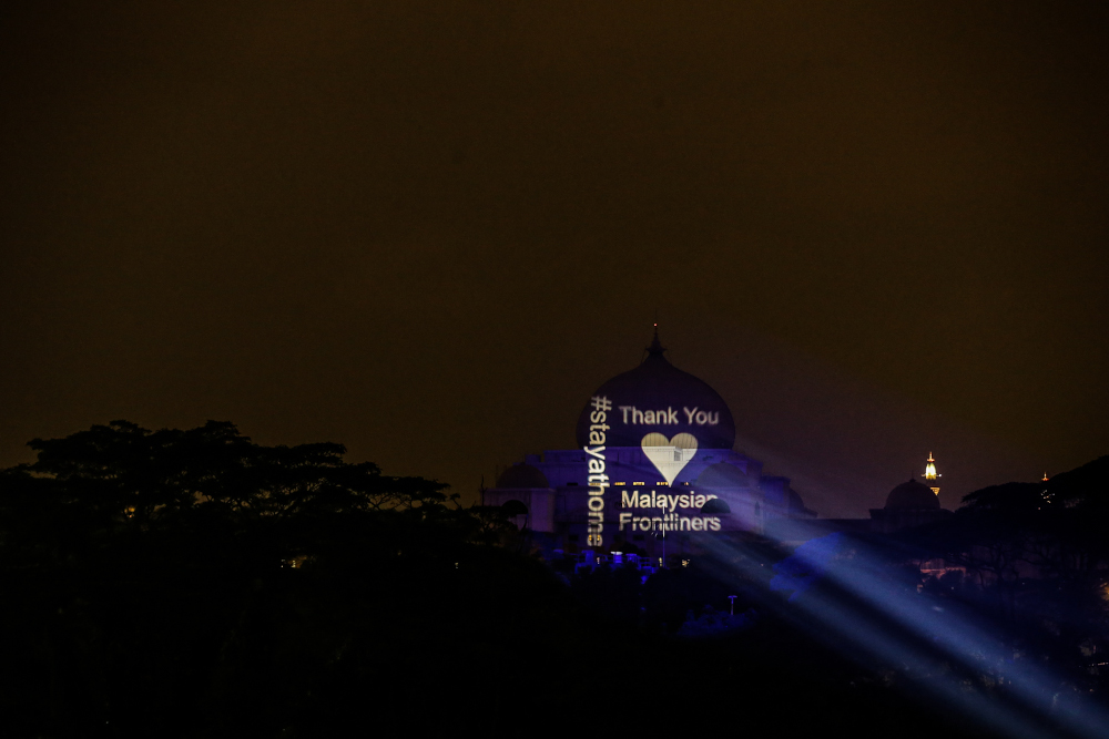 A general view showing the projection mapping on a building reading u00e2u20acu02dc#stayathomeu00e2u20acu2122 and u00e2u20acu02dcThank You Malaysian Frontlinersu00e2u20acu2122 in Kuala Lumpur April 10, 2020. u00e2u20acu201d Picture by Hari Anggara