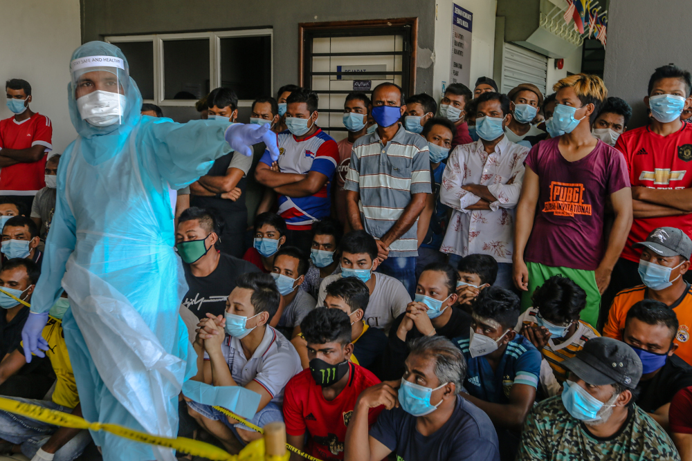 Foreign workers are seen during Covid-19 testing in Kuala Lumpur April 12, 2020. Dapsy's Chiong said legalising undocumented migrants during the immunisation drive would also enable the government to track the vaccine’s efficacy.  — Picture by Firdaus Latif 