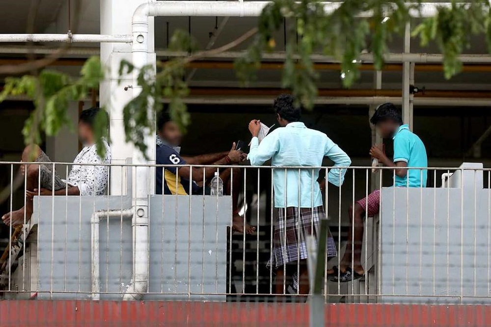Workers gathering at a common area at Sungei Tengah Lodge on April 16, 2020. u00e2u20acu201d TODAY pic